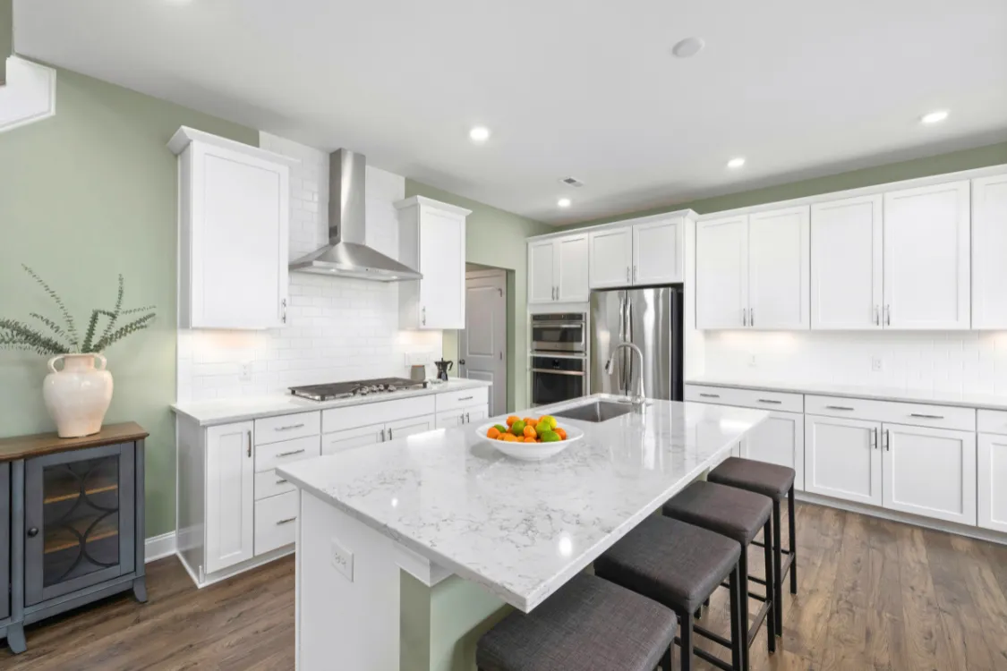 Modern white kitchen with custom cabinet hardware and large island