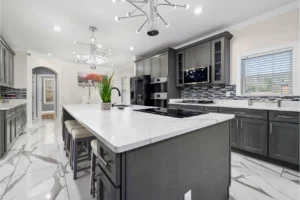 Spacious kitchen layout designed around an efficient work triangle with island and storage