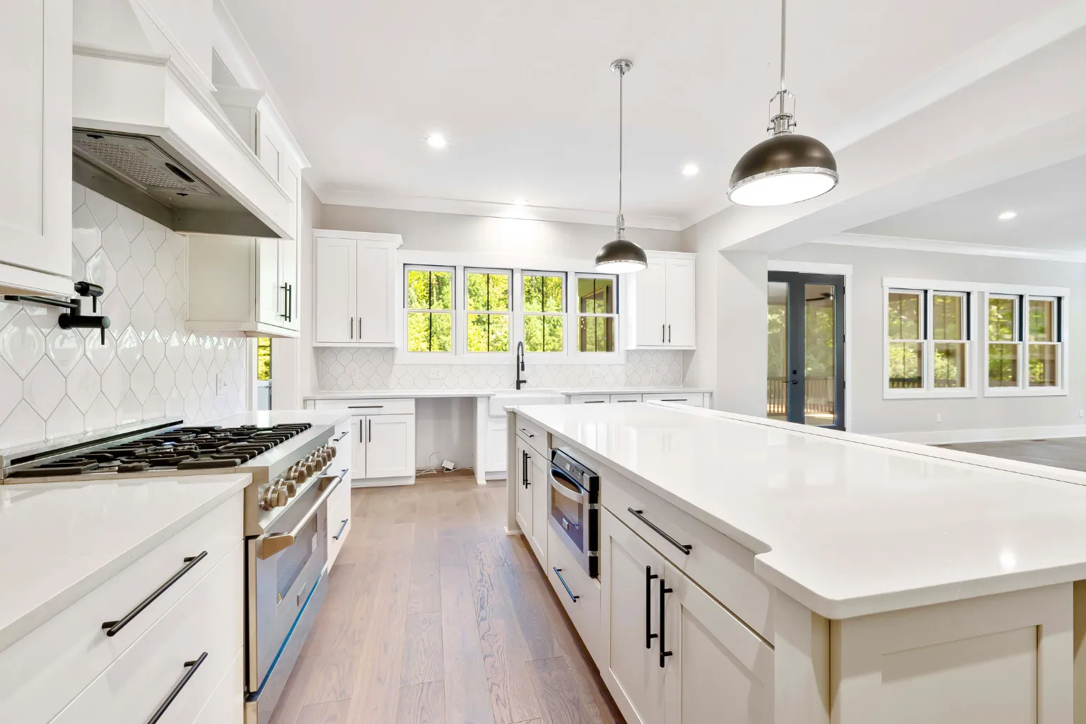 Modern kitchen with blue cabinets, open shelving, and custom cabinet design inspiration