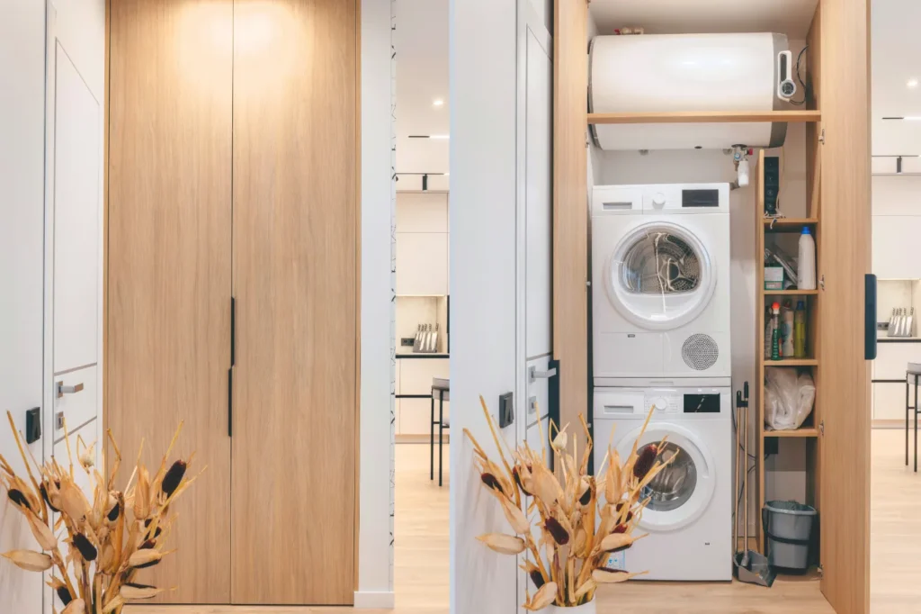 Custom laundry room cabinetry concealing a stacked washer and dryer with built-in storage